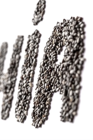 Chia seeds in the shape of the cropped word CHIA. Isolate on white backgroundの写真素材