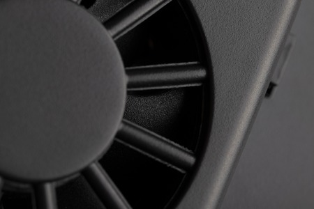 Black fan electronics close-up. Blades in focus.