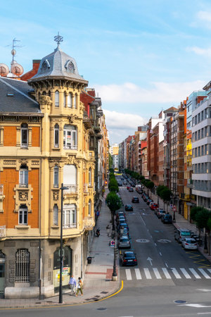 Oviedo, Spain, Asturias - August 2020: Beautiful old building in Oviedo on a city street. Residents are wearing medical protective masks. Coronavirus pandemic in Spain and Europeのeditorial素材