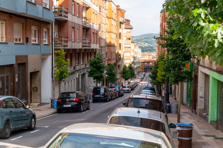 Oviedo, Spain, Asturias - August 2020: Narrow cozy street in a European city with parked carsのeditorial素材
