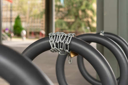 Chain lock close up on a bicycle parking
