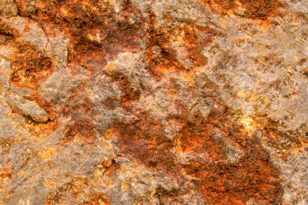 Grungy bright stone close up, rusty stone wall corrosion texture for web design and wallpaper...