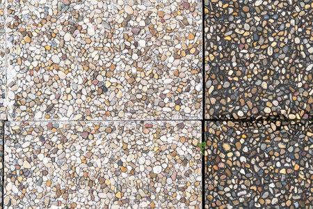 Pebble stone in outdoor tiles with geometric shapes. Close-up. Copy spaceの写真素材