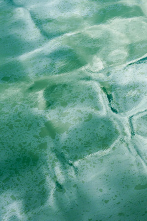 Chemical stains of gasoline and oil on sea water. Ocean pollution and environmental disasters