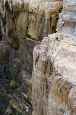 The edge of the rock. Cracked mountain cliff