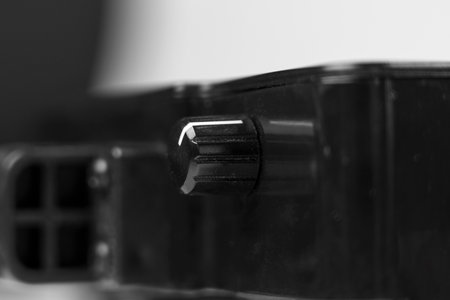 Rotary button for turning on and off the power of the consumed electricity. Savings and efficiency conceptsの写真素材