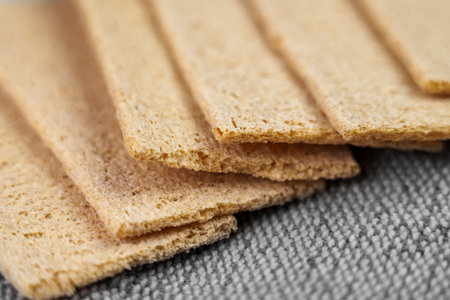 Texture of buckwheat crispbread on a rough rustic burlap. Macroの写真素材