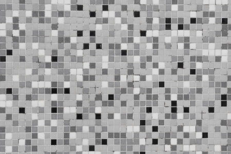 Mosaic grunge exterior wall with square tiles. Abstract background with geometric patternの写真素材
