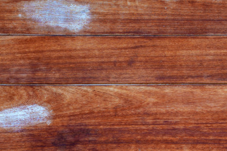 Wooden plank brown background with paint smears close upの写真素材