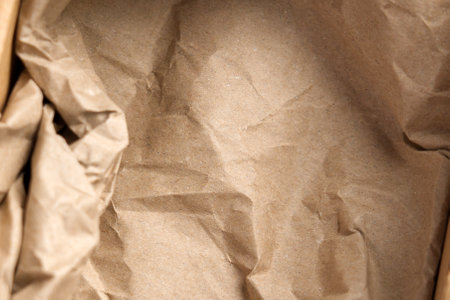 Post cardboard box with crumpled brown paper filler ready for packaging