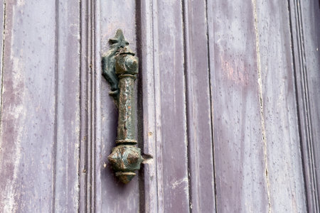 Antique aged corroded metal door knocker close up. Copy spaceの写真素材