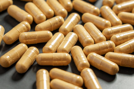 Medical Herbal Adaptogenic Ashwagandha Capsules in Black Plate.の写真素材