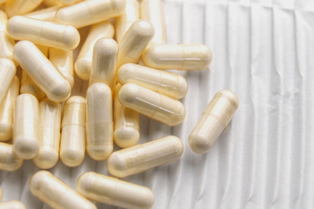 Macro shot of medicine capsules on white corrugated paper. top viewの写真素材