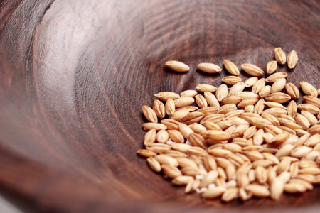 Seeds in a brown wooden bowl close upの写真素材
