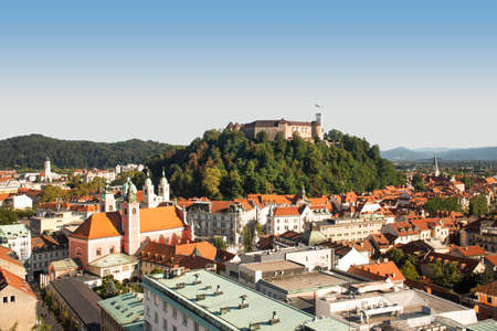 Summer city view of Slovenian Ljubljana Castle on the hill and mountains in the background.のeditorial素材