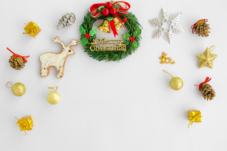 Christmas and New Year background. Christmas wreath with decorations on white background. Creative flat lay, border and copy spaceの写真素材