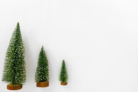 Christmas trees isolated on white background. Creative flat lay, top view designの写真素材