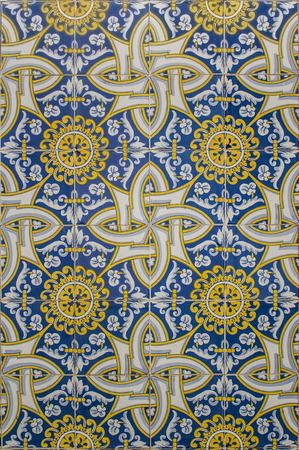 blue and yellow portuguese mosaic made of ceramic tiles