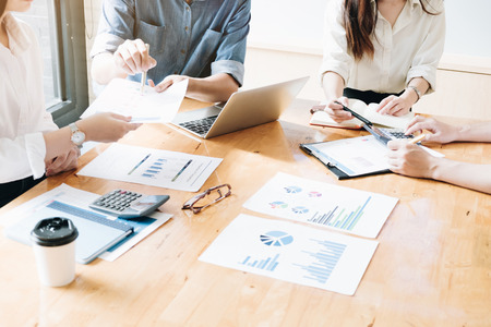 Professional investor and financial meeting present time. Young business team working with new startup project in office room present marketing strategies plan with report,Office Conceptの写真素材