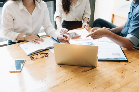 Business Team Meetings present, Business People Meeting Conference Discussion Corporate Concept in meeting room, Group of teamwork businessman and woman investor working new start up projectの写真素材