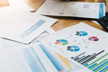 Financial data and marketing growth report graph paperwork in workspace, Business marketing and finance conceptの写真素材