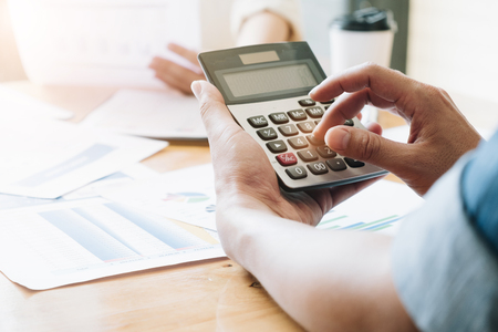 Hand using calculating, Professional business team investor and financial working in office ,Business marketing conceptの写真素材