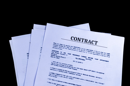 Legal Contract Agreement Documents Papers with black background and top view, Business and Office concept.の写真素材