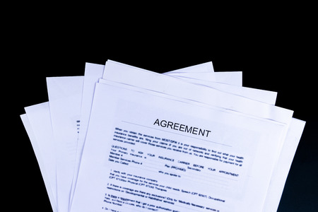 Agreements Documents Papers with black background and top view, Business and Office concept.の写真素材