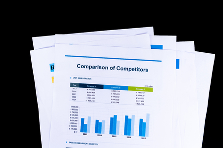 Competitor Comparison Analysis and market research sheet documents papers with black background, Business and Office concept.の写真素材