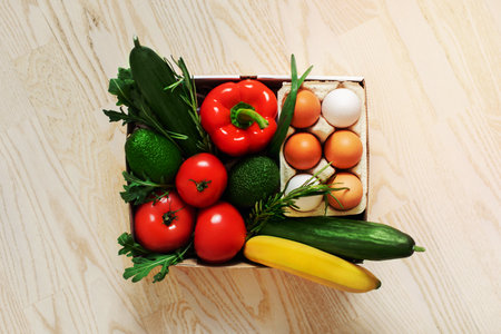 Fresh vegetables in a cardboard box. Fast delivery right from the store.の写真素材