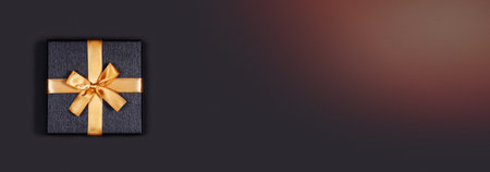 Greeting web banner. Grey background with gift box. Place for the text. Central composition.の写真素材