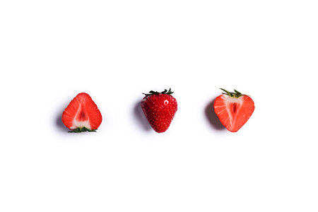 Sweet summer strawberries on an isolated white background.の写真素材