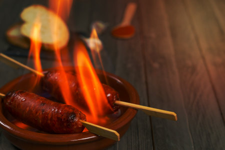 spicy chorizo to hell cooked over a fire right on the tableの写真素材