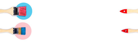 Renovation of the apartment or house for more fruitful work at home. Pink and blue paint brushes on usolated white background.の写真素材