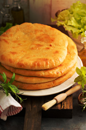 Flatbreads with cheese filling stacked on the plate