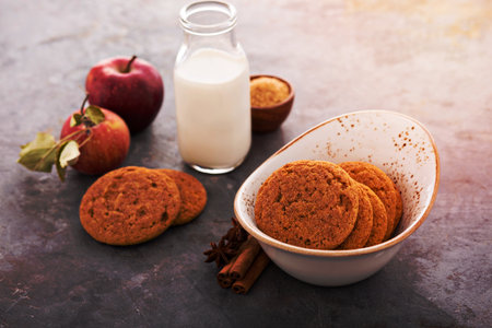 Cinnamon applesauce cookies with spices and milk bottleの写真素材