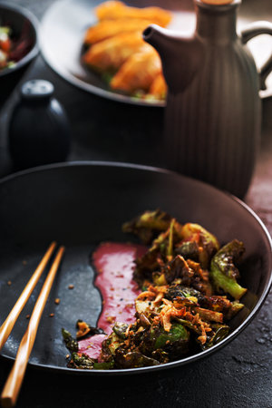Fried brussel sprouts with asian style seasonings and sauceの写真素材