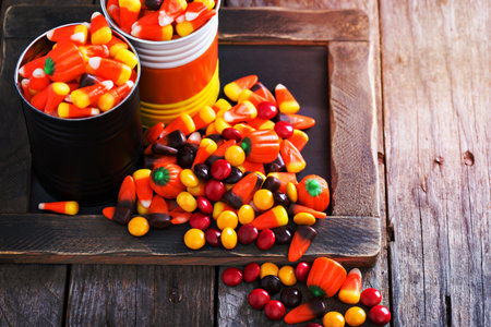 Halloween candy candycorn in two jars copy spaceの写真素材