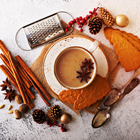 Masala tea in ceramic cup with winter spices and gingerbread cookiesの写真素材