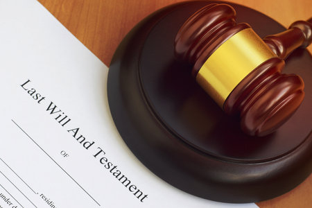 Justice mallet and Last Will and Testament blank document on wooden court table close upの写真素材