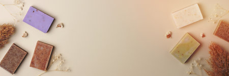 Soap and flower on beige background. Flat lay, copy space.の写真素材