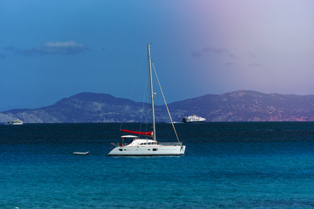 Boats moored on the coast of Ses Illetes beach in Formentera, Balearic Islands in Spain.