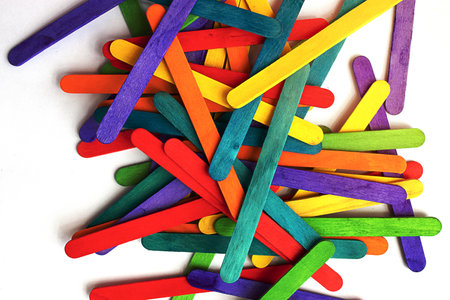 Colorful or rainbow wooden fence from ice cream sticks. LGBT design concept of a greeting card for...