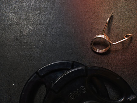 Gym equipment on dark floor backgroundの写真素材