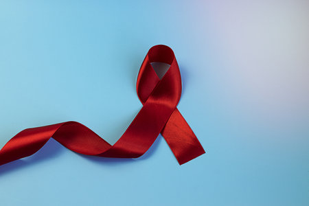 Red ribbon December 1 of every year People around the world hold World AIDS Day to remember those who have died from acquired immunodeficiency syndrome (AIDS).の写真素材