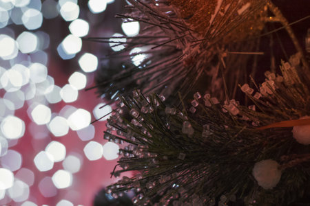 Christmas and New Year holiday background. Close-up of a Christmas tree in the snow against a...