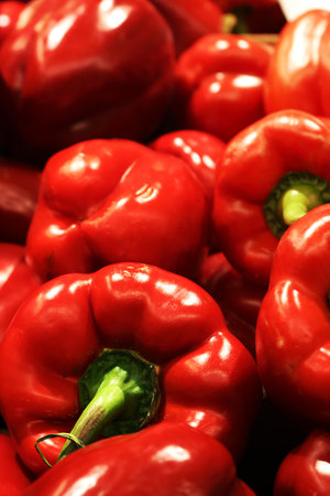 Green fresh pineapples in bright yellow market lightの写真素材