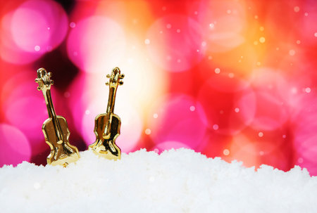 Guitar and christmas decoration on abstract background - selective focus shotの写真素材