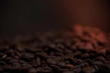 The hot of brown roasted coffee beans on brown background with copyspace, Healthy products by organic natural ingredients conceptの写真素材