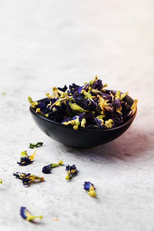 Butterfly pea tea Anchan Dried flowers to make tea Stone backgroundの写真素材